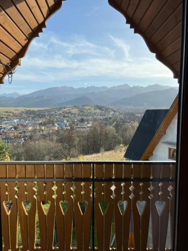 a view of the mountains from the balcony of a house at Janickowa Ostoja - Noclegi w Zakopanem in Zakopane