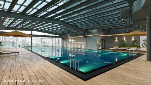 a large swimming pool in a large building at Full House - The Matrix One in Hanoi