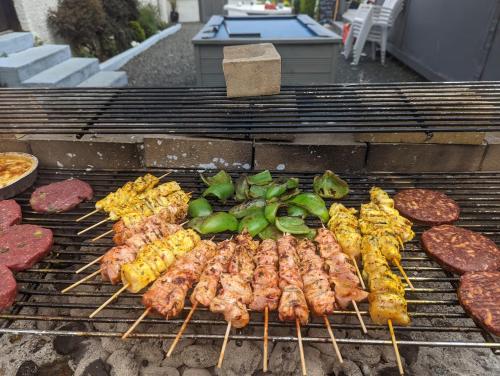 a bunch of different types of food on a grill at Bonnyside House in Bonnybridge