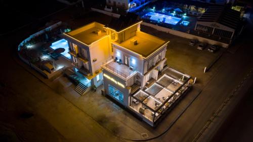 an aerial view of a house at night at Osman Aga Hotel in Iskele