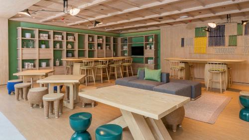 a restaurant with tables and chairs in a room at Holiday Inn Resort Samui Bophut Beach by IHG in Bophut 