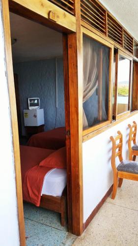 Ένα ή περισσότερα κρεβάτια σε δωμάτιο στο Hostal Estrella de Mar