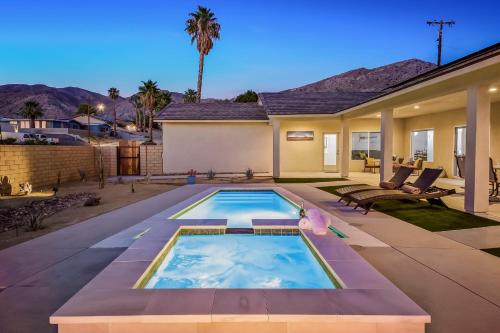 a swimming pool in the backyard of a house at New House For Your Comfort in Desert Hot Springs
