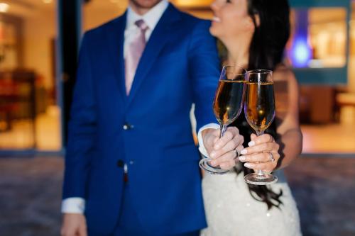 a bride and groom holding glasses of champagne at Holiday Inn Express & Suites Trinity by IHG in Trinity