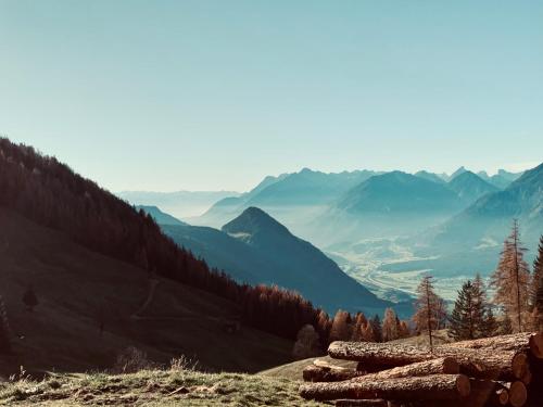 a view of a valley with mountains in the background at Natural Deluxe Apartments Alpbach in Alpbach