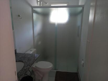 a bathroom with a shower and a toilet at Casa Brasil pousada e lazer in Trindade