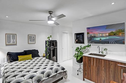 a bedroom with a bed and a sink at Stylish Luxury Tropical Junior Suite in Fort Lauderdale