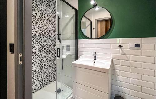 a bathroom with a sink and a mirror at 1 Bedroom Stunning Apartment In Gdansk in Gdańsk