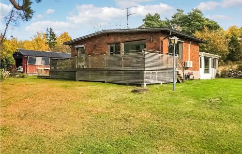 a brick house with a large yard in front of it at 3 Bedroom Cozy Home In Svanesund in Svanesund