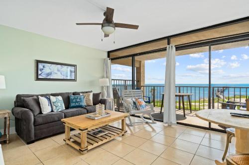 a living room with a couch and a table at Laguna Reef #308 - Beautiful Bay View in Rockport