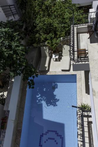 an overhead view of a blue swimming pool with trees at Hideaway in Kas