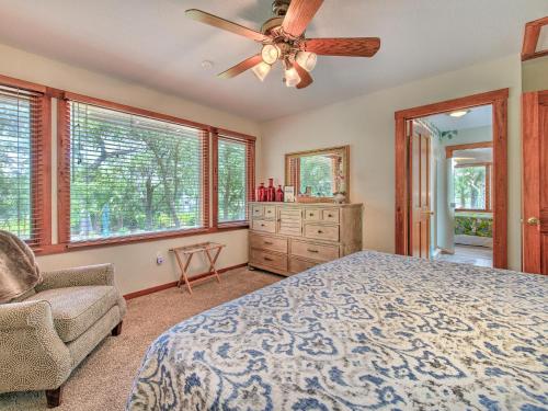 a bedroom with a bed and a ceiling fan at Riverbend Retreat Fla in Riverview