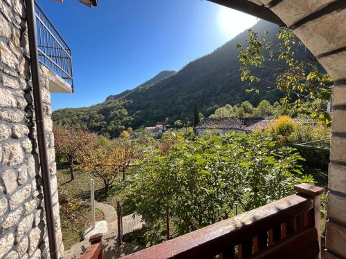 a view of a mountain from a window at Bed & Wine Djonovic in Virpazar