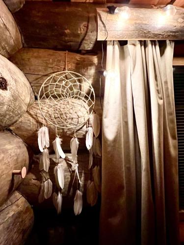 a net with white feathers hanging from a curtain at Ruka View at the Slopes Ski in, Family & Bike Park, National Park, hike trails - Lapland Villas in Ruka