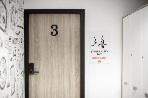 a close up of a door with a sign on it at ONRest Hostel Centrum Żytnia 8 FaktVat in Kielce