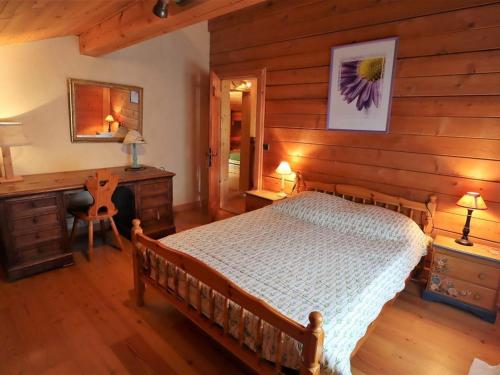 a bedroom with a bed and a desk at Chalet Arêches-Beaufort, 9 pièces, 10 personnes - FR-1-342-232 in Beaufort