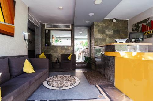 a living room with a couch and a counter at NewCity Hotel & Suites in Cairo