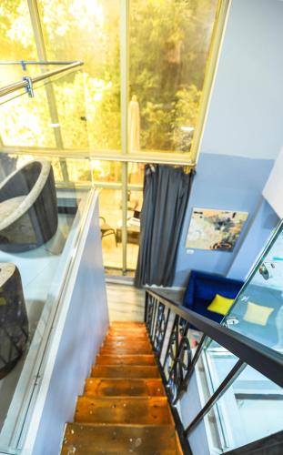 a spiral staircase in a house with a window at NewCity Hotel & Suites in Cairo