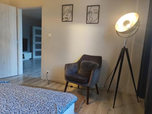 A bed or beds in a room at Senza apartman