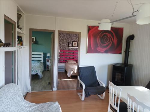 a living room with a room with a bedroom at Chambre privée dans chalet au calme in Saint-Brisson