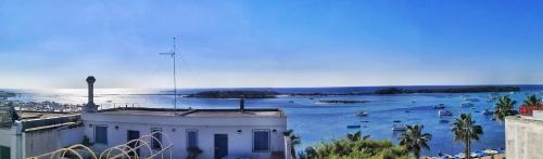 a view of a harbor with boats in the water at Salento Sea & Sun Apartment in Porto Cesareo
