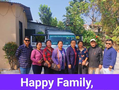 a group of people standing in front of a truck at Hotel Butterfly - Peaceful Garden for Nature Lovers in Sauraha