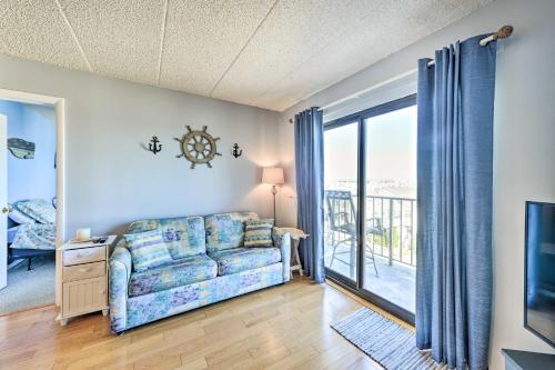a living room with a couch and a large window at Beachfront North Wildwood Condo with Ocean Views! in North Wildwood