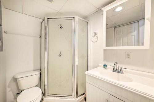 a bathroom with a shower and a toilet and a sink at Beachfront North Wildwood Condo with Ocean Views! in North Wildwood