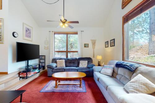 a living room with a couch and a table at Whispering Pines 323 in Durango