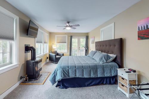 a bedroom with a bed and a fireplace at East End Annex in Portland
