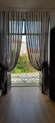 a large window with a view of a yard at Hotel Abade João in Montemor-o-Velho