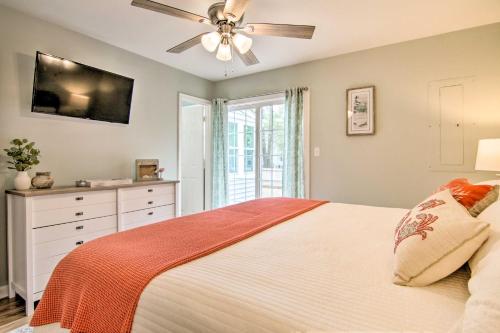 a bedroom with a bed and a ceiling fan at Water Access, Sunroom Ocean View Escape! in Ocean View