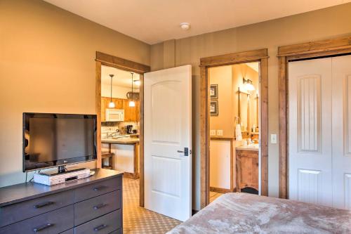 a bedroom with a flat screen tv on a dresser at Cozy Kellogg Condo - Ski at Silver Mountain Resort in Kellogg