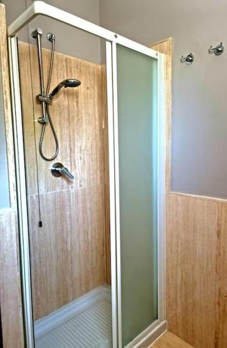 a shower with a glass door in a bathroom at Il Lago Incantato in Lonato del Garda