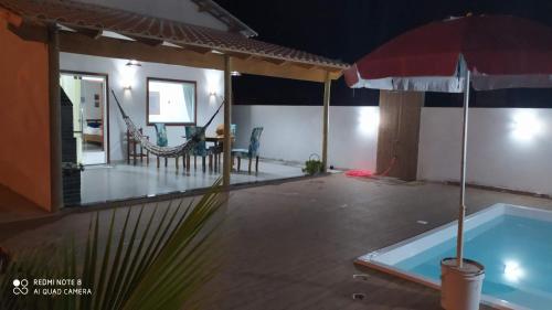 Kolam renang di atau dekat dengan Bangalô praia de Guaratiba Prado com piscina privativa