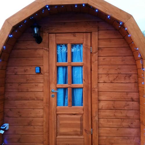 a wooden garage door with a window at Bassano Up in Mussolente 