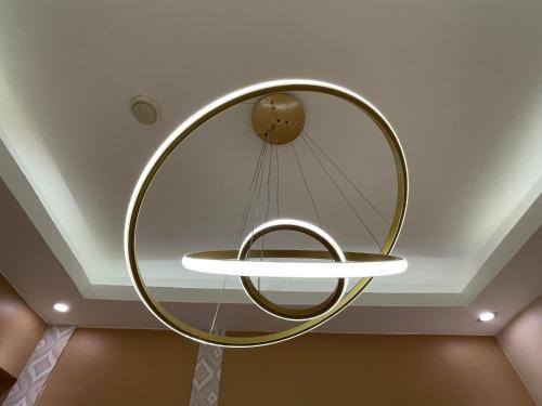 a round mirror in a room with a ceiling at SMDC Trees Residences Tower 1 - 2BR Newly Renovated Staycation in Manila