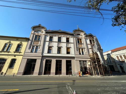 a large building on the corner of a street at Olimpia Residence Palace Oradea in Oradea