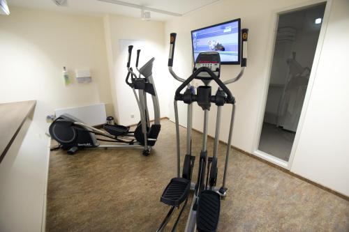 a gym with cardio equipment in a room at Best Western Plus Hotel Bremerhaven in Bremerhaven