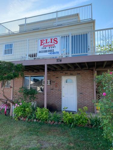 a building with a sign that reads bills pharmacy with a balcony at ELIS APARTMENT in Ocean City