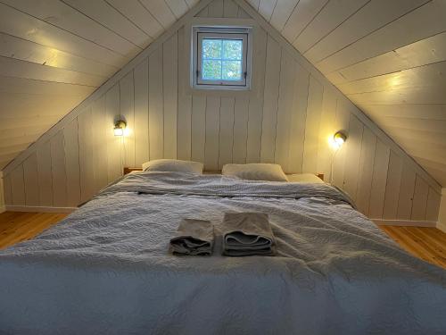 a bedroom with a large bed in a attic at RoaldsPiren Stavanger in Stavanger