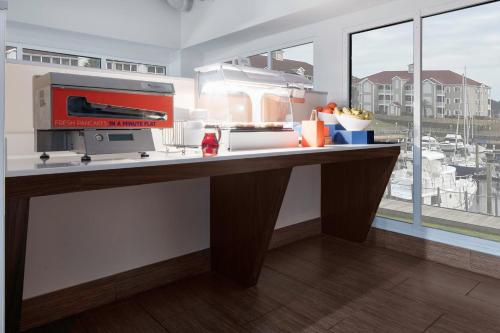 a kitchen with a counter with a machine on it at Holiday Inn Express North Myrtle Beach - Little River by IHG in Little River