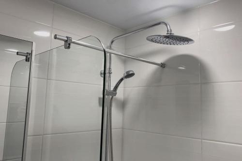 a shower with a glass door in a bathroom at Central City in Incheon