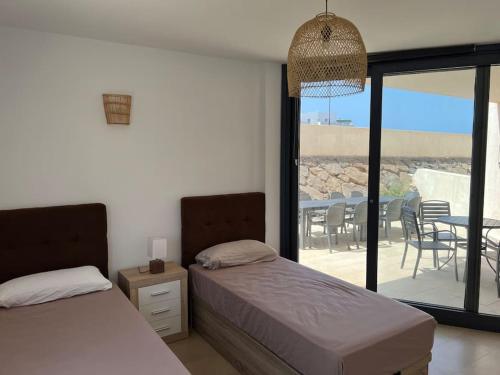 Posteľ alebo postele v izbe v ubytovaní El Cotillo Ocean View