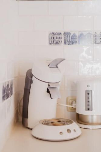 a kitchen counter with a coffee maker and a toaster at HOLLAND Holiday Home in Ermelo
