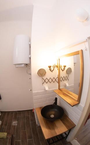 a bathroom with a sink and a mirror at Apartments & Room - Korzo in Sombor