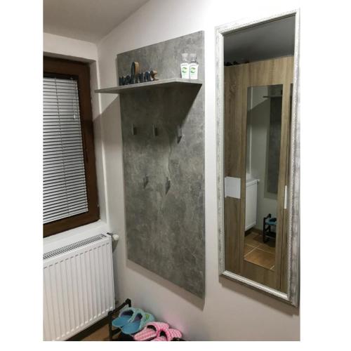 a bathroom with a mirror on the wall at Apartman Jevtic Zlatibor in Zlatibor
