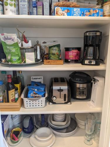 a kitchen pantry with a coffee maker and food at Central location close to Downtown and Mountain Views in South Salt Lake