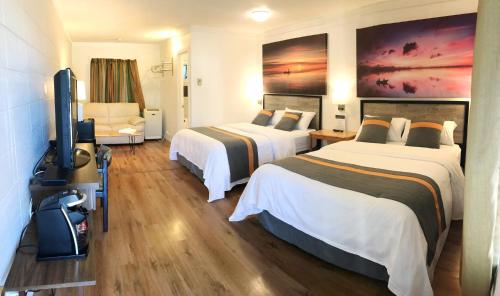 Postel nebo postele na pokoji v ubytování Duncan Motel