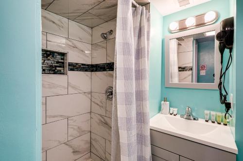 a bathroom with a shower and a sink at Lovely 2 Bedroom, 2 Bath Unit in West Alexandria. in Alexandria